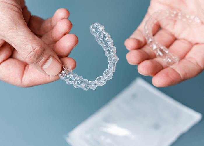 hands holding invisalign